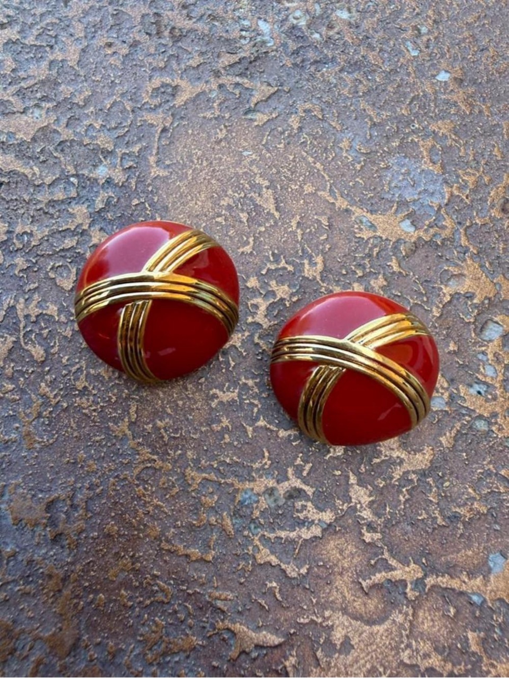 Vintage Monet red enamel button earrings with polished gold-tone crisscross